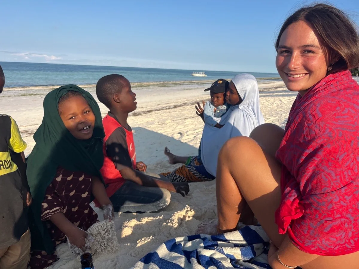 Zanzibari children and families spending time together on the beach