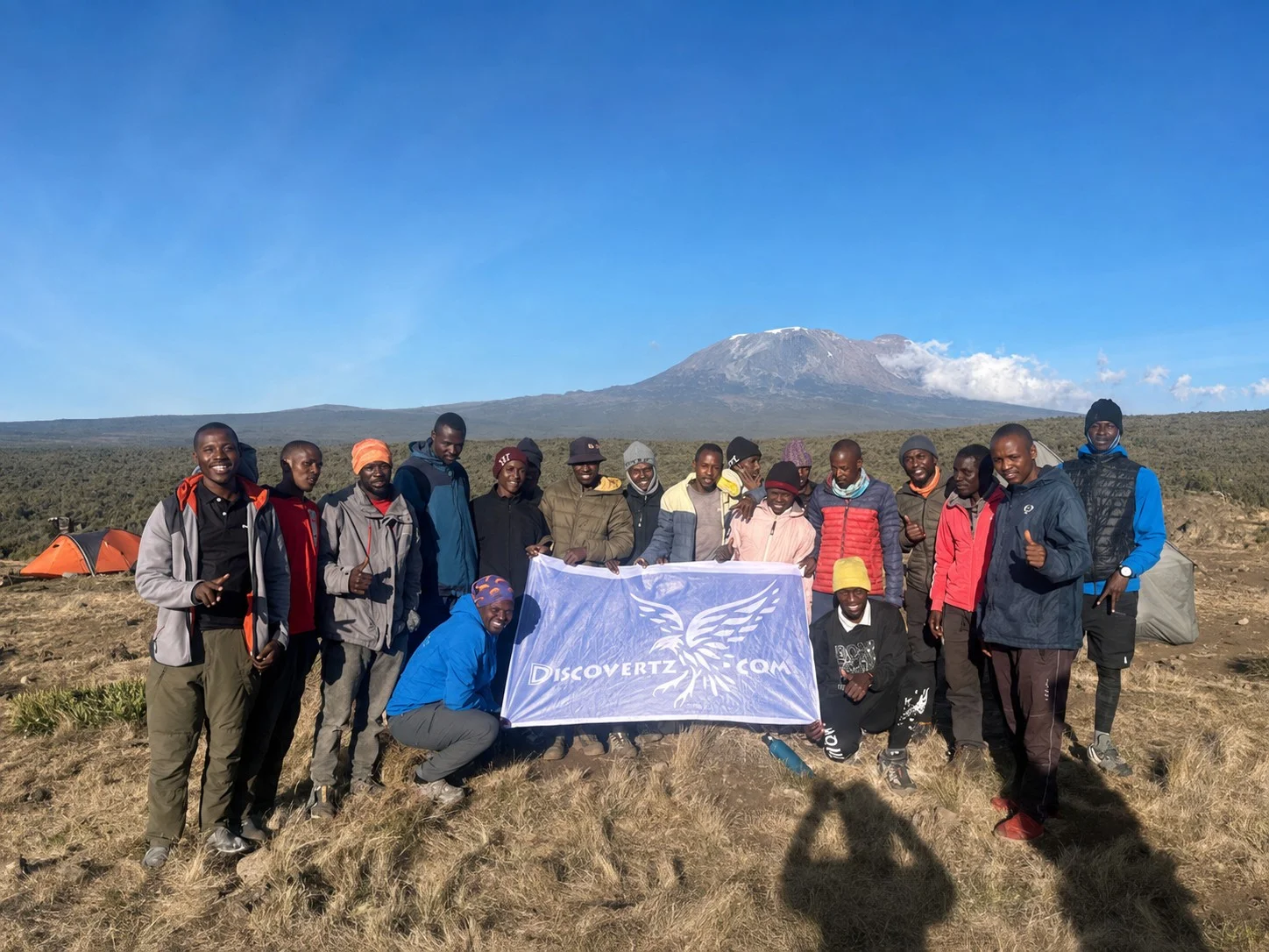 The trekking team together below Kilimanjaro
