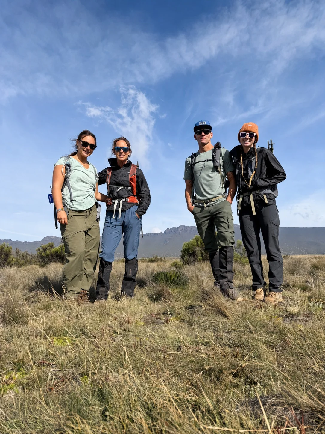 Four travelers together during their Mount Kilimanjaro trek